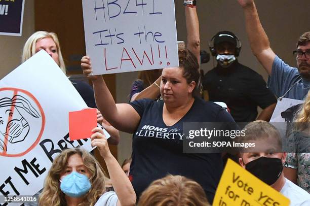 Member of Moms for Liberty protests against mandatory face masks for students during the COVID-19 pandemic at a meeting of the Brevard County School...