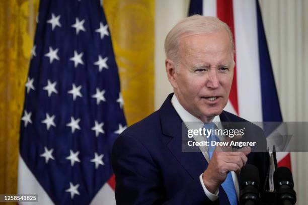 President Joe Biden answers a question during a joint press conference with Prime Minister of the United Kingdom Rishi Sunak in the East Room at the...