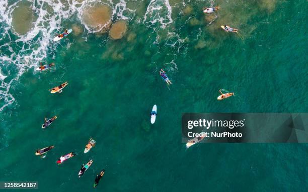 People play with surf boards in Arugam Bay, Sri Lanka, on June 8, 2023. World Ocean Day is an international day that takes place annually on June 8....