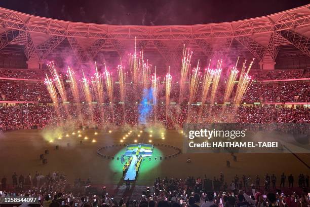 Fans watch fireworks at Al-Ittihad's stadium in Jeddah during a ceremony to unveil former Real Madrid striker Karim Benzema, on June 8, 2023. Benzema...