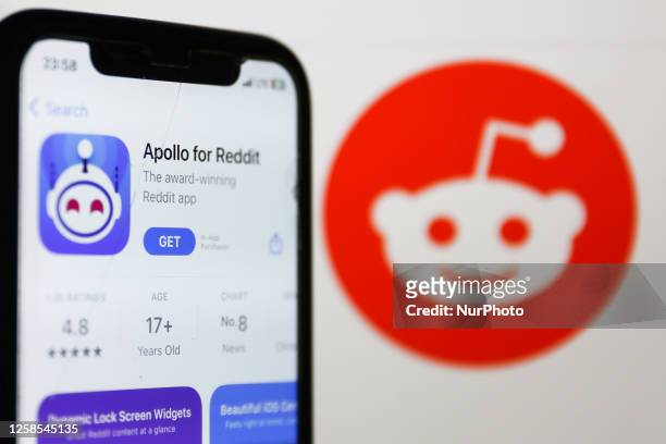 Apollo for Reddit on AppStore displayed on a phone screen and Reddit logo on the website displayed on a screen are seen in this illustration photo...