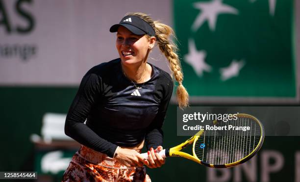 Caroline Wozniacki of Denmark playing doubles with Kim Clijsters of Belgium during the Legends Trophy on Day Twelve of Roland Garros on June 08, 2023...