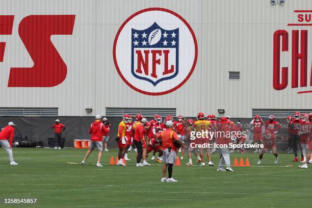 Wide view of the NFL logo on a building while the Kansas City Chiefs warm up during OTA's on June 8, 2023 at the Kansas City Chiefs Training Facility...