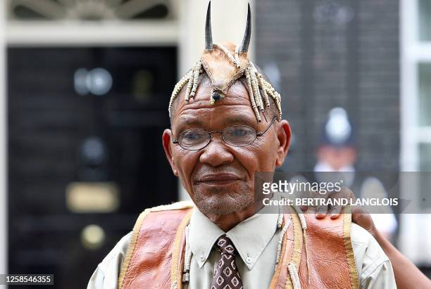 Bushman leader Roy Sesana of the Kalahari addresses the media outside N°10 Downing Street in central London, 24 May 2007, before meeting with...