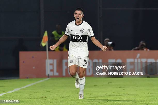 Olimpia's defender Mateo Gamarra celebrates after scoring a goal during the Copa Libertadores group stage second leg football match between...