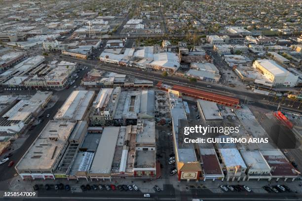 Aerial view of the Chinesca neighbourhood in downtown Mexicali, Baja California state, Mexico on May 9, 2023. A dark basement in La Chinesca, a...