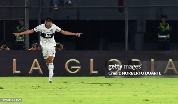 Olimpia's defender Mateo Gamarra celebrates after scoring a goal during the Copa Libertadores group stage second leg football match between...