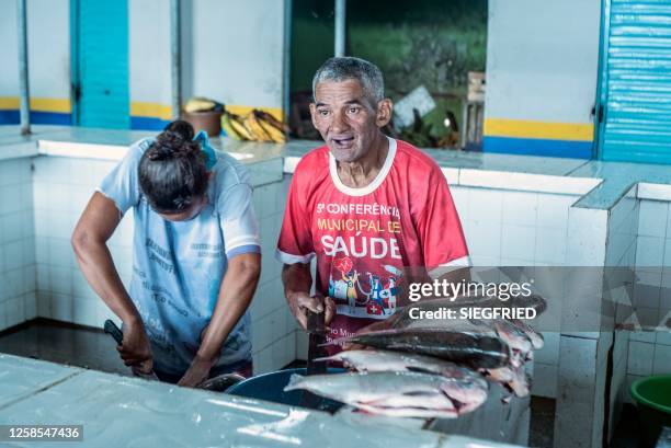 Fishermen work in the fish market of Atalia do Norte, northwest of Brazil, on May 15, 2023. In the indigenous territory of the Javari Valley, illegal...