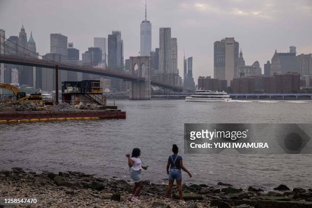 The Manhattan skyline is seen as smoke from wildfires in Canada cause hazy conditions in New York City on June 8, 2023. Smoke from Canadian wildfires...
