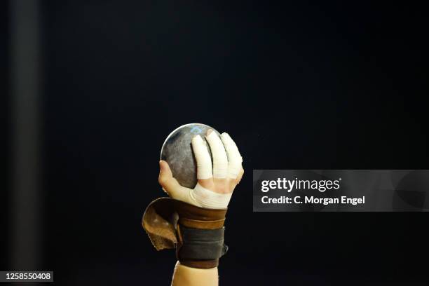 An athlete holds up a shot put ball during the Division I Men's and Women's Outdoor Track & Field Championship on June 8, 2023 in Austin, Texas.