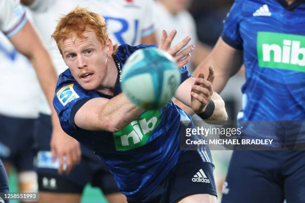 Blues' Finlay Christie passes the ball during the Super Rugby quarter-final match between the Auckland Blues and New South Wales Waratahs at Eden...