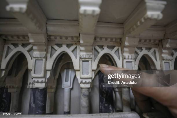 Masad Hamza shows his Masjid Al-Haram model in Port Said province of Egypt on June 4, 2023. Masad Hamza, an Egyptian model maker, was impressed by a...