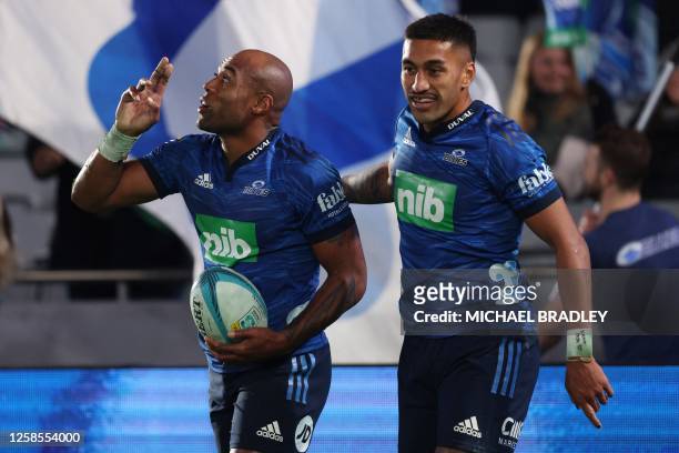 Blues' Mark Telea celebrates a try with Rieko Ioane during the Super Rugby quarter-final match between the Auckland Blues and New South Wales...