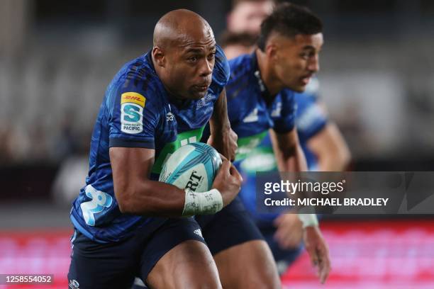 Blues' Mark Telea runs for a try during the Super Rugby quarter-final match between the Auckland Blues and New South Wales Waratahs at Eden Park in...
