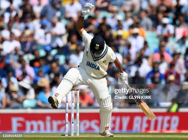 India's Shardul Thakur reacts after being hit on the hand by the ball during play on day 3 of the ICC World Test Championship cricket final match...