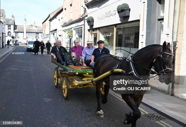 Archbishop of York Stephen Cottrell , rides on a horse-drawn carriage as he ais shown around on the second day of the annual Appleby Horse Fair, in...