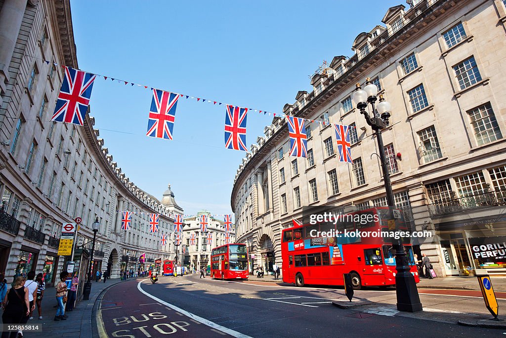Regents St with red buses and bunting