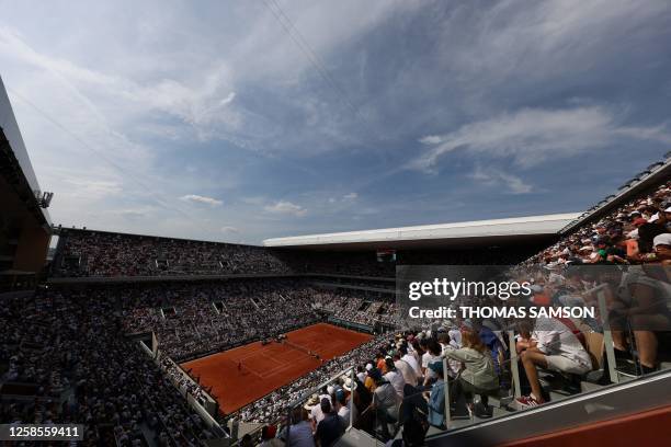 General view shows the men's singles semi-final match between Spain's Carlos Alcaraz Garfia and Serbia's Novak Djokovic on day thirteen of the...