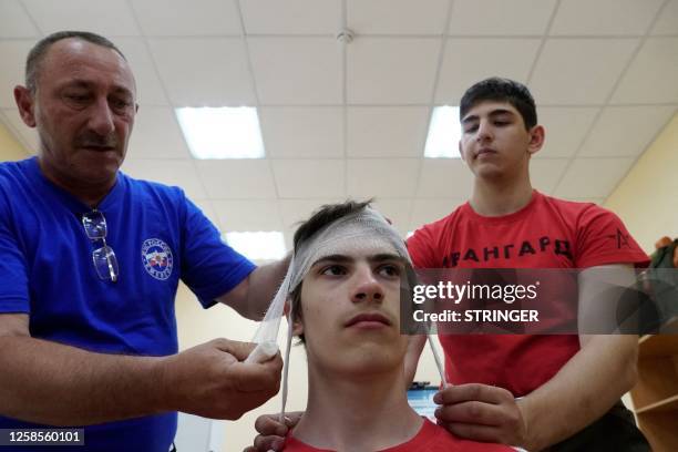 Teenagers undergo a first aid training at an Avangard military-patriotic educational camp in the southern Rostov region on June 9, 2023.