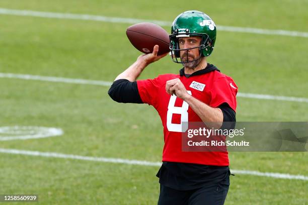 Quarterback Aaron Rodgers of the New York Jets attempts a pass during the team's OTA's at Atlantic Health Jets Training Center on June 9, 2023 in...