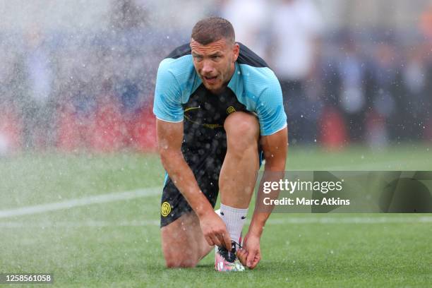 Edin Dzeko of Inter Milan reacts as he is hit by a water sprinkler during the Inter Milan FC Training Session And Press Conference at Ataturk Olympic...