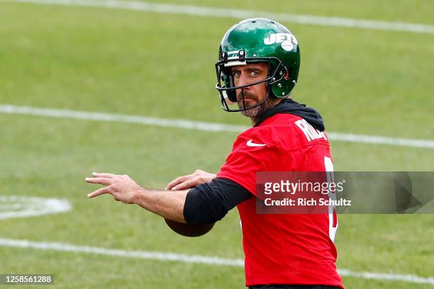 Quarterback Aaron Rodgers of the New York Jets attempts a pass during the team's OTA's at Atlantic Health Jets Training Center on June 9, 2023 in...