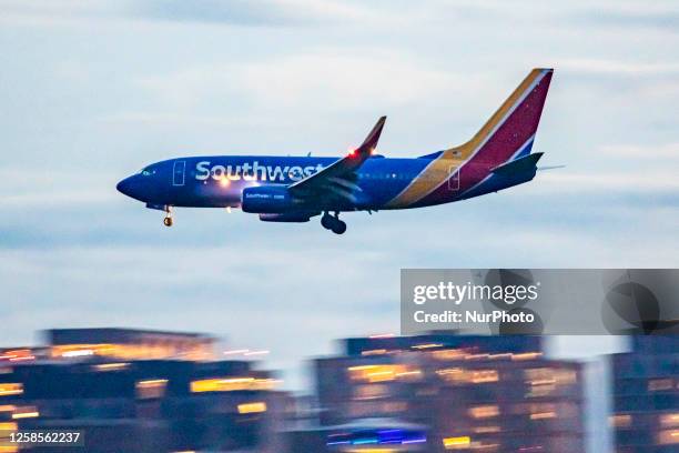 Southwest Airlines Boeing 737-700 aircraft as seen landing at dusk time at Ronald Reagan Washington National Airport DCA in Arlington County,...