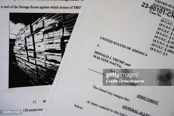 In this photo illustration, pages are viewed from the unsealed federal indictment of former U.S. President Donald Trump on June 9, 2023 in...