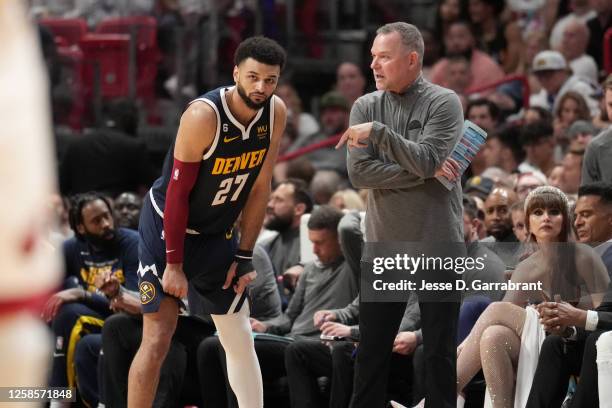 Jamal Murray of the Denver Nuggets talks with Head Coach Michael Malone of the Denver Nuggets during Game Four of the 2023 NBA Finals on June 9, 2023...