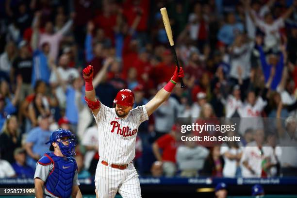 Kyle Schwarber of the Philadelphia Phillies reacts after he hit a game winning home run in the ninth inning against the Los Angeles Dodgers in a game...