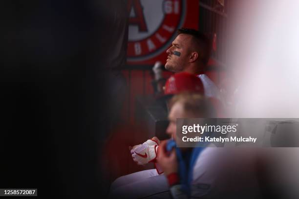 Mike Trout of the Los Angeles Angels looks on from the dugout during the game between the Seattle Mariners and the Los Angeles Angels at Angel...