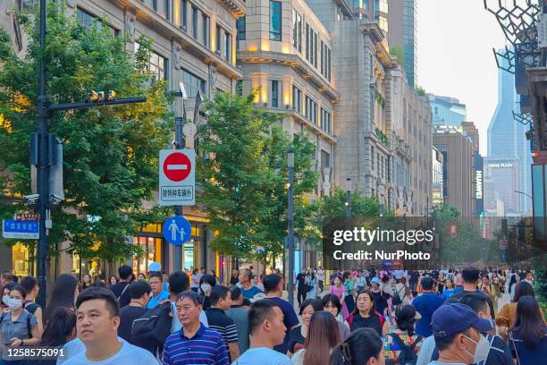 Tourists are swarming the Nanjing Road pedestrian street in Shanghai, China, on June 8, 2023.