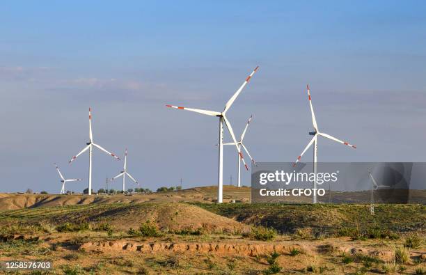 Photo taken on June 10, 2023 shows a distributed wind power farm in Ordos city, Inner Mongolia, China.