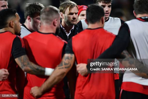 Crusaders' coach Scott Robertson huddles with team members prior to the start of the Super Rugby quarter-final match between the Crusaders and Fijian...