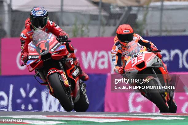 Ducati Italian rider Francesco Bagnaia competes to claim the pole position ahead of Honda Spanish rider Marc Marquez during the qualifying rounds...