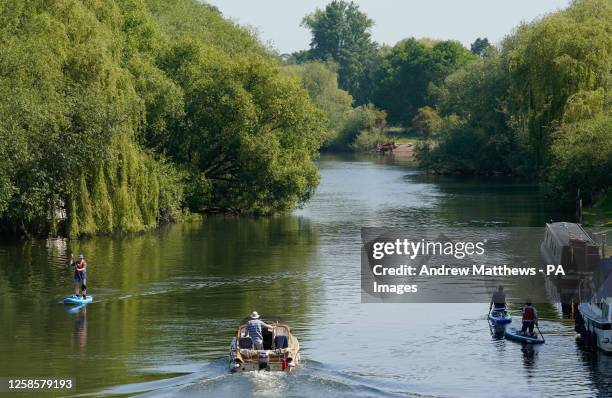 People make their way along the river Thames in Wallingford, Oxfordshire. Picture date: Saturday June 10, 2023.