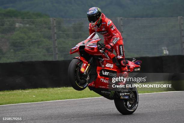 Ducati Italian rider Francesco Bagnaia celebrates after taking the pole position after the qualifying rounds ahead of the Italian MotoGP race at...