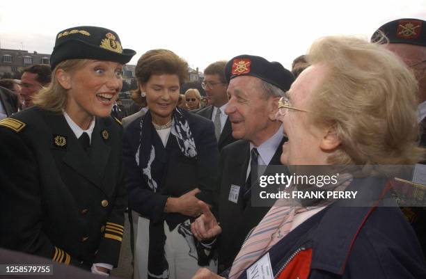 Princess Astrid of Belgium and Princess Margaretha of Luxemburg chat with Belgium WWII veterans, 05 June 2004 in Deauville, during a ceremony marking...