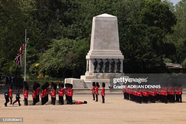 Member of the Grenadier Guards faints during the Colonel's Review at Horse Guards Parade in London on June 10, 2023 ahead of The King's Birthday...