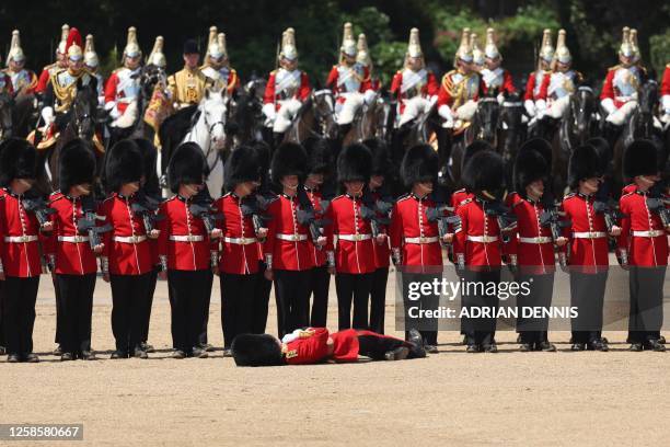 Member of the Grenadier Guards faints during the Colonel's Review at Horse Guards Parade in London on June 10, 2023 ahead of The King's Birthday...