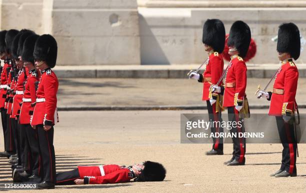Member of the Grenadier Guards faints during the Colonel's Review at Horse Guards Parade in London on June 10, 2023 ahead of The King's Birthday...
