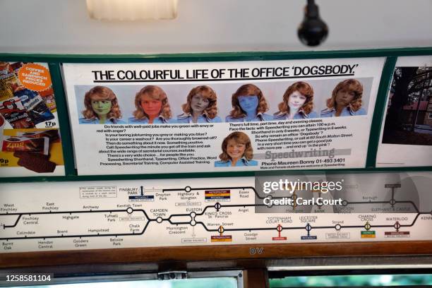 Vintage tube map and advert are pictured on a 1938 Art Deco-style London underground train during an event to mark the 160th birthday of the London...