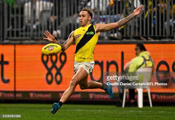 Shai Bolton of the Tigers snaps a kick on goal during the 2023 AFL Round 13 match between the Fremantle Dockers and the Richmond Tigers at Optus...