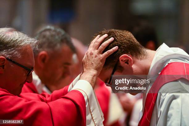 Blessing of newly ordered proest during a ceremony for the ordination of 15 new priests at the Duomo Cathedral, in Milan, Italy on June 10, 2023.