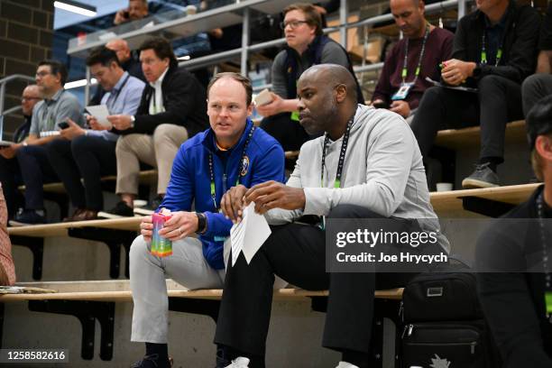 General managers Kevyn Adams of the Buffalo Sabres and Mike Grier of the San Jose Sharks talk during the 2023 NHL Scouting Combine at the LECOM...