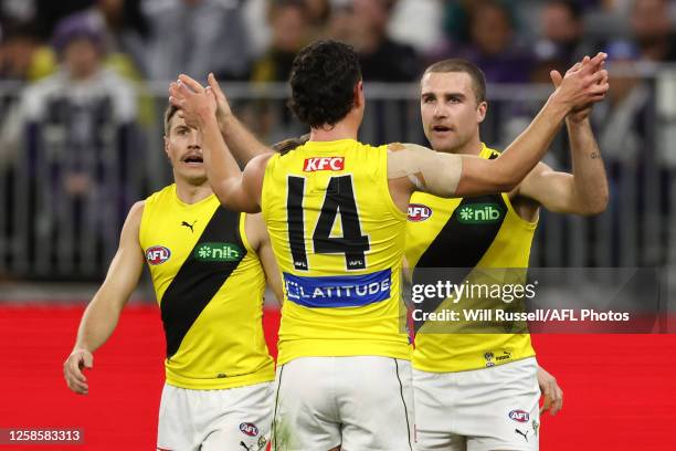 Jack Ross of the Tigers celebrates after scoring a goal during the 2023 AFL Round 13 match between the Fremantle Dockers and the Richmond Tigers at...