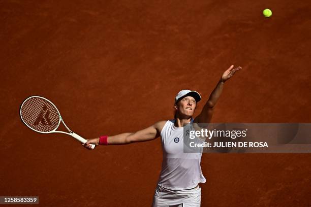 Poland's Iga Swiatek serves to Czech Republic's Karolina Muchova during their women's singles final match on day fourteen of the Roland-Garros Open...