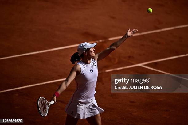 Poland's Iga Swiatek serves to Czech Republic's Karolina Muchova during their women's singles final match on day fourteen of the Roland-Garros Open...