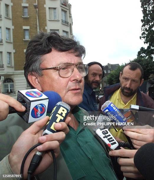 Secretary general of French union CGT's Textile section, Christian Larose, addresses the press 19 July 2000 prior to the talks holding in...