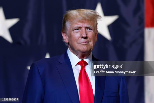 Former U.S. President Donald Trump arrives to deliver remarks during the Georgia state GOP convention at the Columbus Convention and Trade Center on...